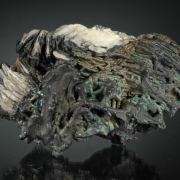 Psilomelane - iridescent, on Barite