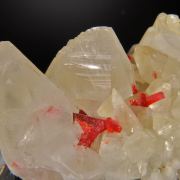 Realgar in and on  Calcite