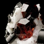 Spessartine Garnet and Schorl on Albite