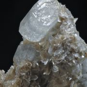 Beryl (elongated crystals) on Muscovite