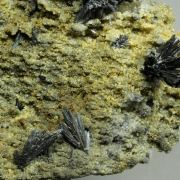 Stibnite on Quartz with Siderite