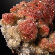 Calcite enclosing Hematite (2 generations)
