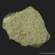 Calcite (fluorescent) on Quartz