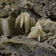 Cerussite on Quartz - elongated sixling twins