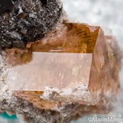 Bixbyite on Hematite after Garnet on Topaz