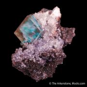 Calcite included with Malachite on matrix