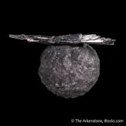 Stibnite on Calcite included by Boulangerite