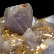 Herderite on Siderite