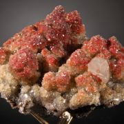Calcite enclosing Hematite (2 generations)