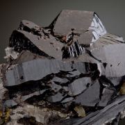Cassiterite -huge for locale, with Ferberite, Arsenopyrite, Chalcopyrite, Quartz, Muscovite, Stannite,  Fluorite etc. 