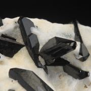 Neptunite on Natrolite