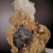 Cinnabar (twinned crystals on Quartz and Calcite)