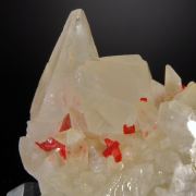 Realgar in and on  Calcite