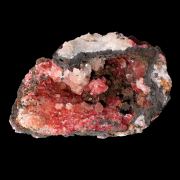 Calcite included by Cuprite var. Chalcotrichite