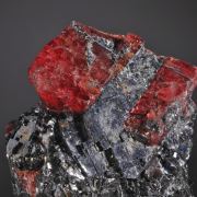 Rhodonite (doubly terminated crystal included by Galena)