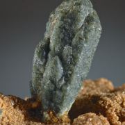 Quartz -included by Hedenbergite on Andradite
