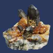Spessartine garnet on Quartz (Smoky) with Orthoclase