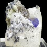 Zoisite var. tanzanite, calcite, graphite
