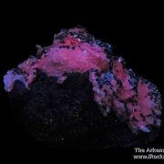 Manganoan Calcite (fl) on Tennantite and Sphalerite, with Pyrite