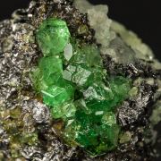Tsavorite on Graphite