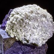 Huge Elmwood Barite Ball on Fluorite
