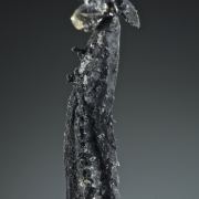 Silver, elongated spinel-twin, floater