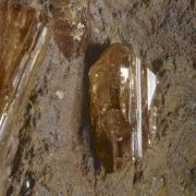 Topaz (Imperial) on matrix, rare red fluorescent