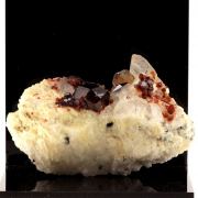 Spessartine Garnet, Orthose, Quartz.