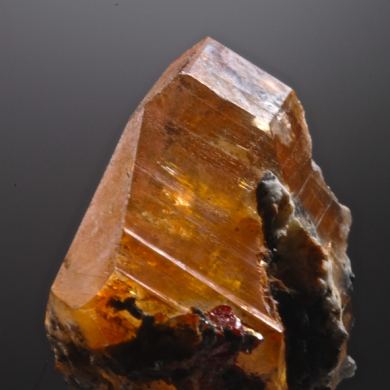 Calcite included by Realgar