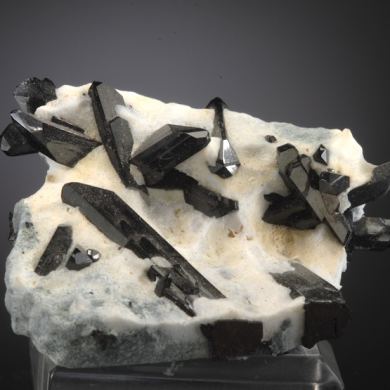 Neptunite on Natrolite