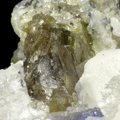Zoisite var. tanzanite, calcite, graphite