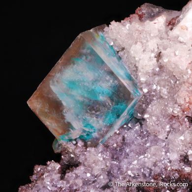 Calcite included with Malachite on matrix