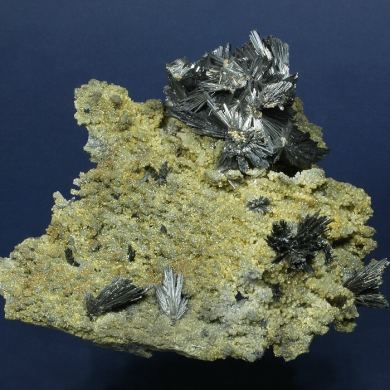 Stibnite on Quartz with Siderite
