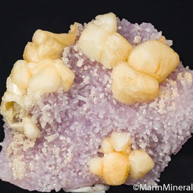 Calcite on Amethyst