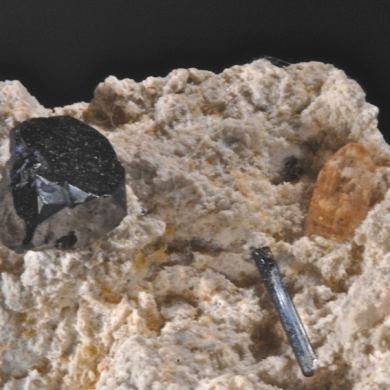 Bixbyite, Pseudobrookite & Topaz