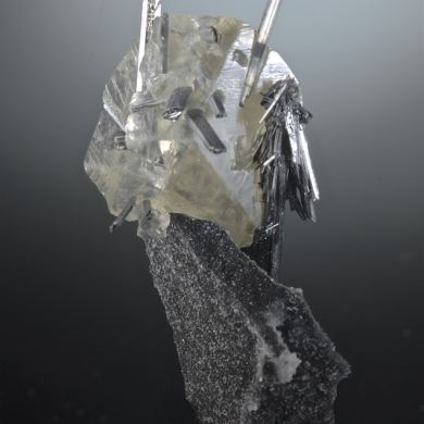 Stibnite in and on Calcite