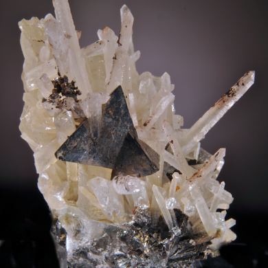 Helvite (unusually sharp crystals) on Quartz. Ex George Loud