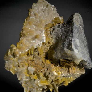 Wulfenite (fluorescent) with Galena, Calcite etc.
