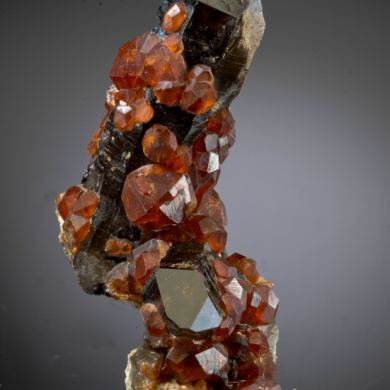 Spessartine on Smoky Quartz