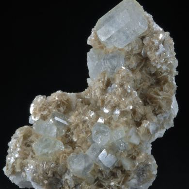 Beryl (elongated crystals) on Muscovite