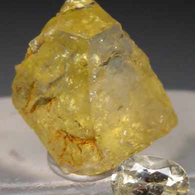 Rhodizite rough and cut set