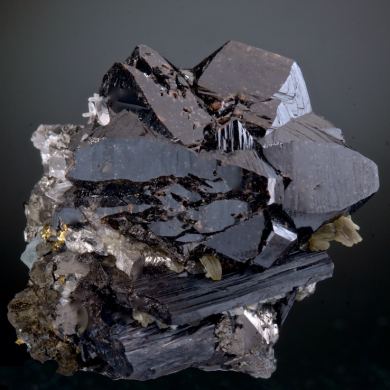 Cassiterite -huge for locale, with Ferberite, Arsenopyrite, Chalcopyrite, Quartz, Muscovite, Stannite,  Fluorite etc. 