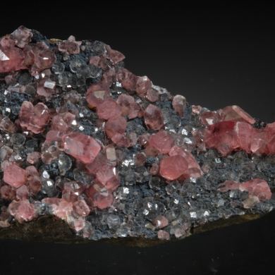 Rhodochrosite on Fluorite with Goethite