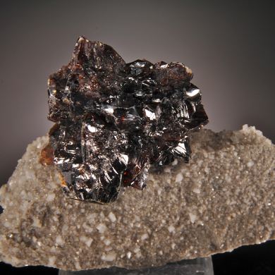 Sphalerite (red-black crystals) on Calcite with Fluorite