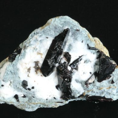 Neptunite on Natrolite