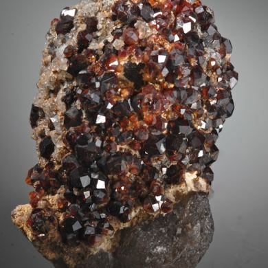 Spessartine on Hyalite Opal and Quartz