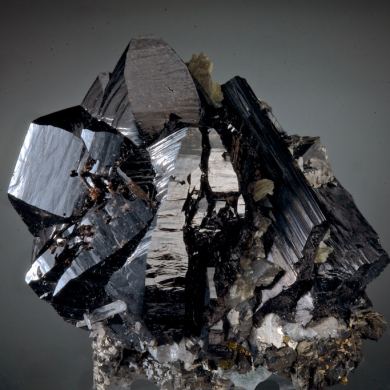 Cassiterite -huge for locale, with Ferberite, Arsenopyrite, Chalcopyrite, Quartz, Muscovite, Stannite,  Fluorite etc. 