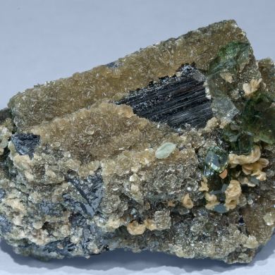 Fluorapatite with Ferberite, Siderite and Muscovite