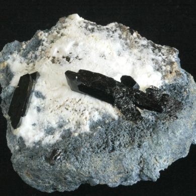 Neptunite on Natrolite