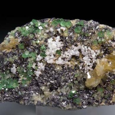 Tsavorite, Diopside on Graphite